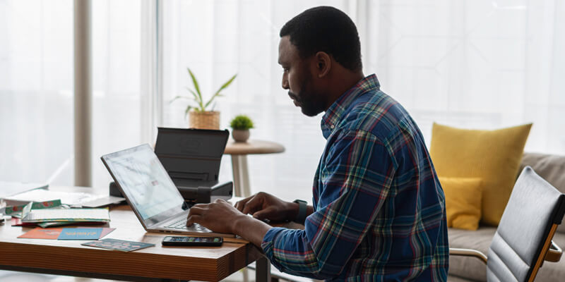 Man-at-desk-home-working - digital broking is the star attraction